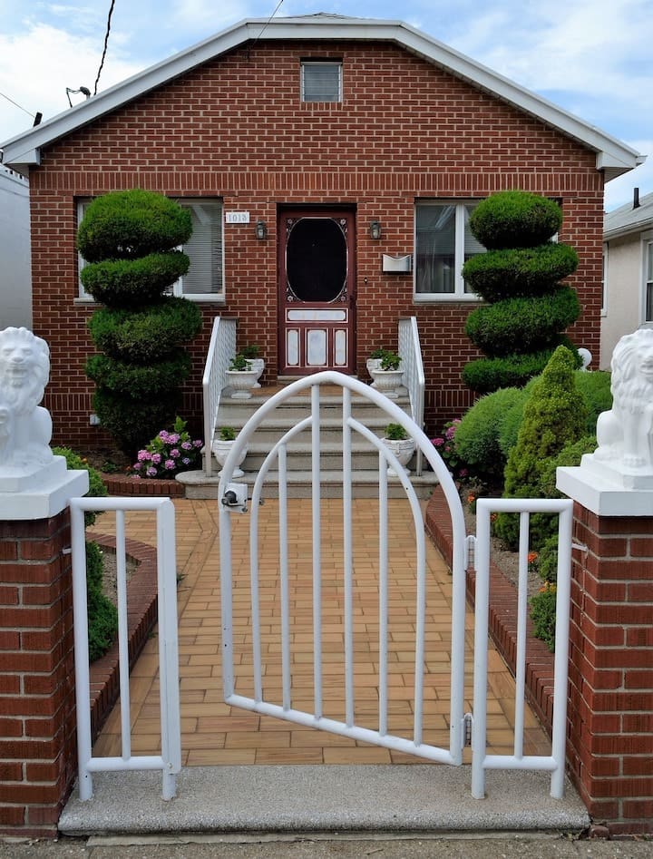 real estate and estate planning in the Phoenix Valley - red brick house with open white gate