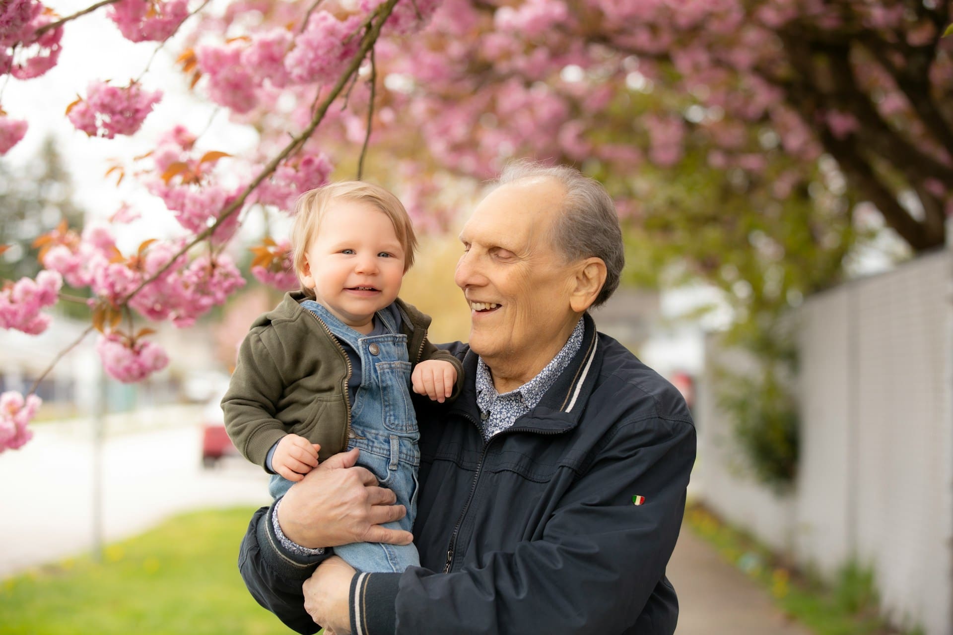 grandpa holding grandchild