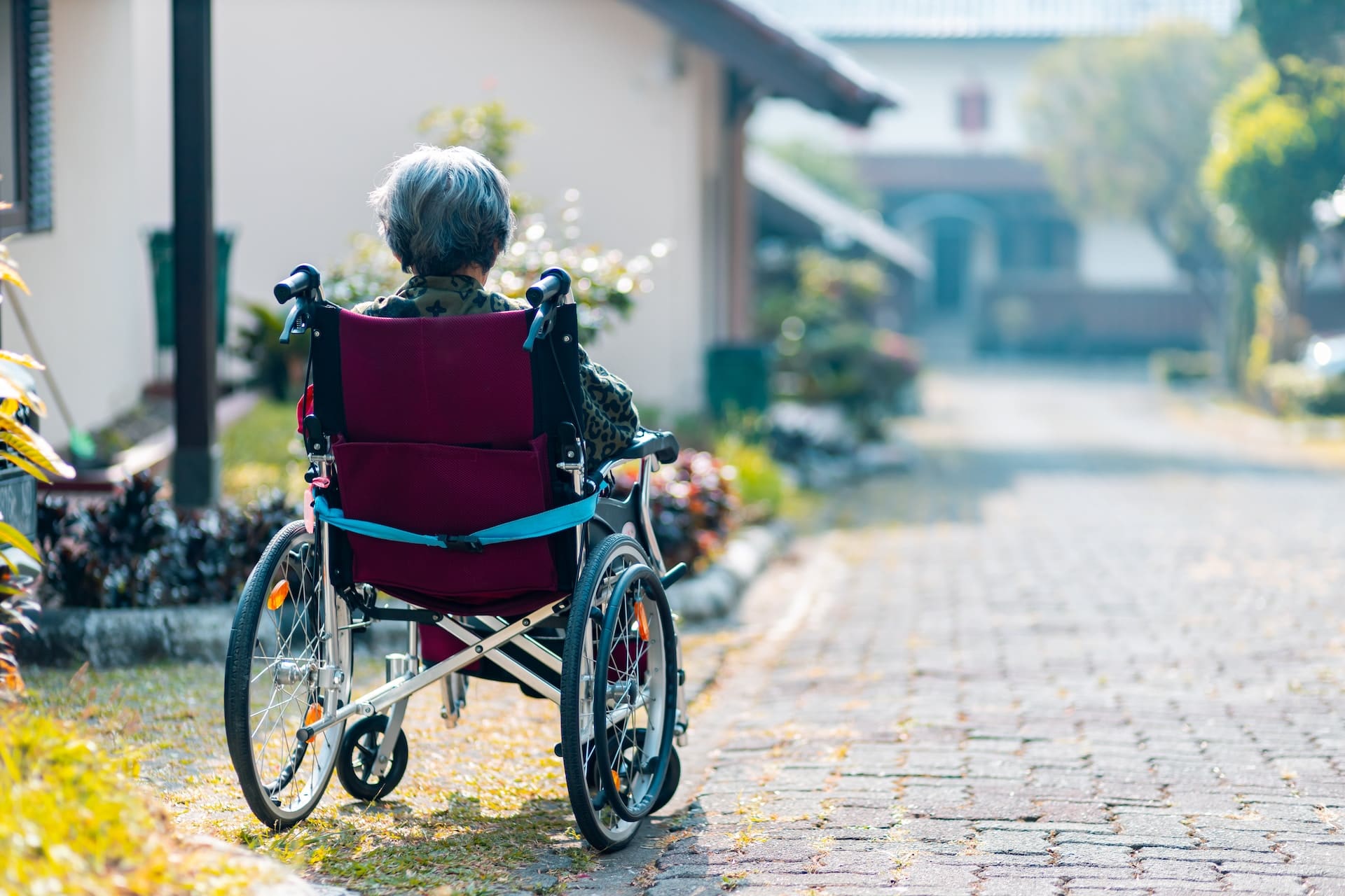 woman in wheelchair sitting outside
