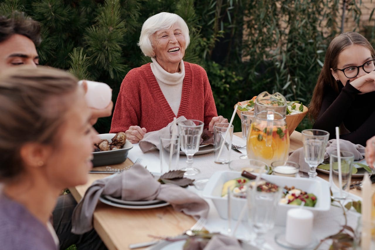 Happy family enjoying dinner together in a garden