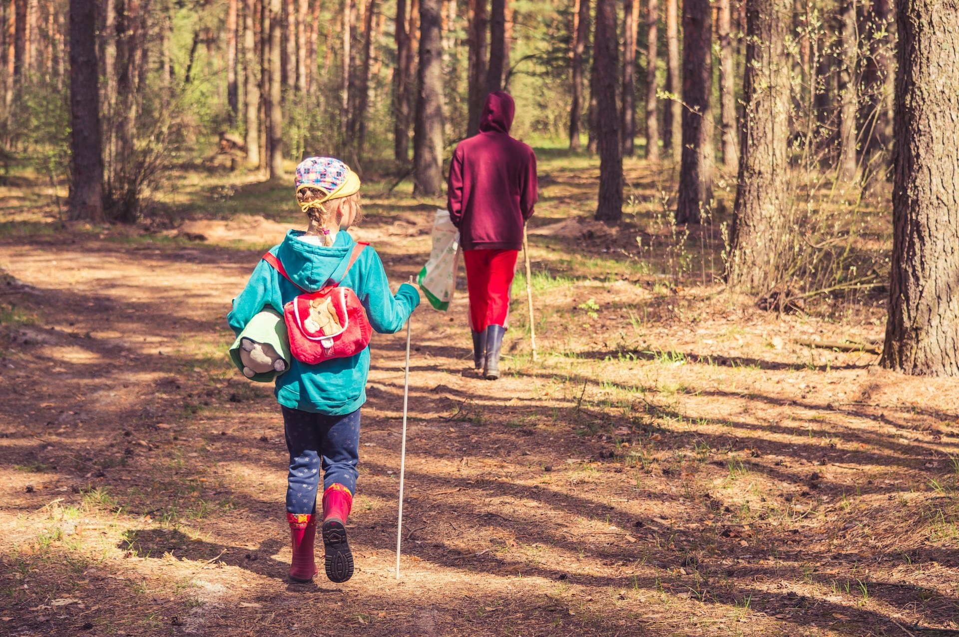 two children hiking through woods